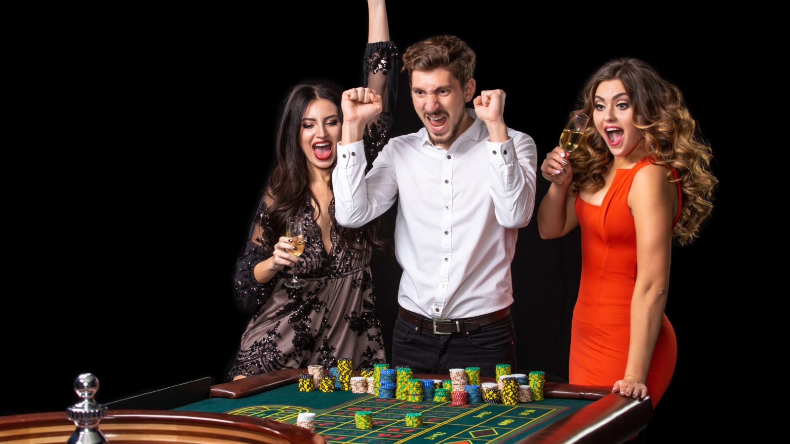 Group of young people looking excited at spinning roulette. Roulette table in a casino. Black background